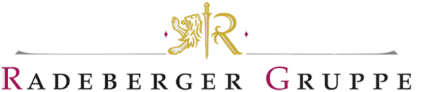 Ein goldfarbenes Wappen mit einem Löwen und zwei vertikalen Streifen daneben.